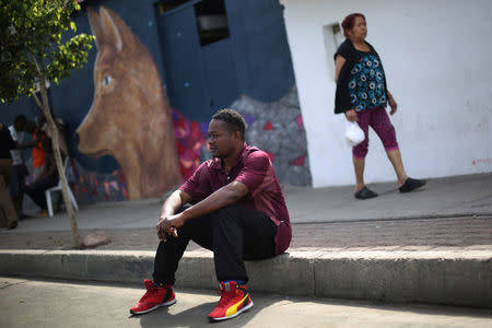 Haitian migrant, Normilus Mondesir, 38, sits outside Juventud 2000 shelter after leaving Brazil, where he relocated to after Haiti's 2010 earthquake, in Tijuana, Mexico, October 7, 2016. Picture taken October 7, 2016. REUTERS/Edgard Garrido