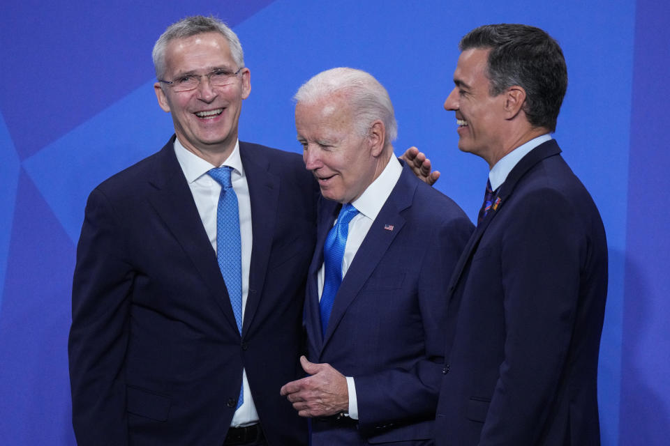 FILE - President Joe Biden, center, talks to NATO Secretary General Jens Stoltenberg, left, and Spanish Prime Minister Pedro Sanchez at the official arrivals for the NATO summit in Madrid, Spain, on Wednesday, June 29, 2022. Biden is welcoming outgoing NATO Secretary-General Jens Stoltenberg to the White House on Monday, June 12, 2023, as the competition to find his successor to lead the military alliance heats up. Stoltenberg, who has led NATO since 2014 indicated earlier this year he would move on when his term expires at the end of September. (AP Photo/Bernat Armangue, File)