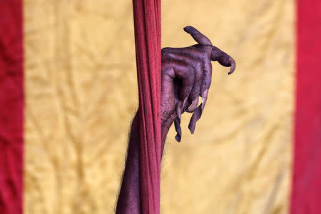 The hand of a Sadhu, or Hindu holy man, who has not moved his arm and cut his fingernails for 10 years, is raised inside his camp during "Kumbh Mela", or the Pitcher Festival, in Prayagraj, previously known as Allahabad, India, January 17, 2019. REUTERS/Danish Siddiqui