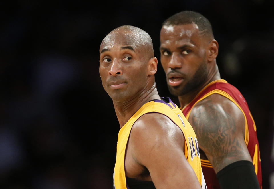 Kobe Bryant and LeBron James both carried the Michael Jordan torch. (AP)