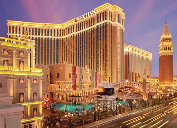 Venetian resort in Las Vegas, with streaks of cars on Strip going by.