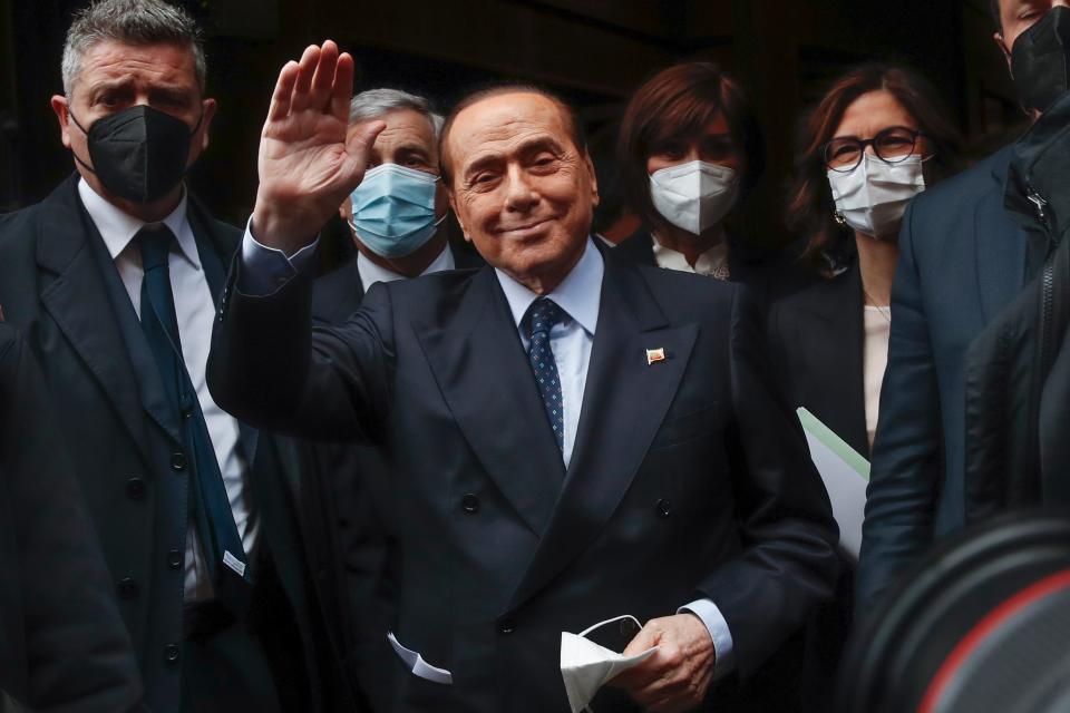 Former Italian Premier Silvio Berlusconi waves to reporters in Rome in 2021.