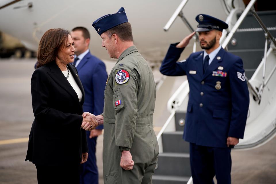 Vice President Kamala Harris is greeted by Col. Ted Geasley, Commander of the 118th Wing, as she arrives at Berry Field Air National Guard Base before meeting with Tennessee legislators at Fisk University in Nashville, Tenn., on Friday, April 7, 2023. 