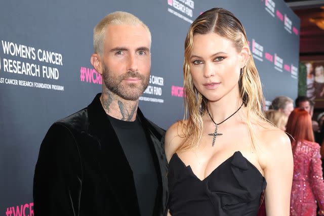 <p>Gilbert Flores/Getty</p> Adam Levine and wife Behati Prinsloo attend an event in March.