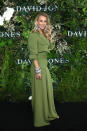 <p>Anna Heinrich matched the media wall to perfection in this striking green trouser suit. Photo: Getty Images </p>