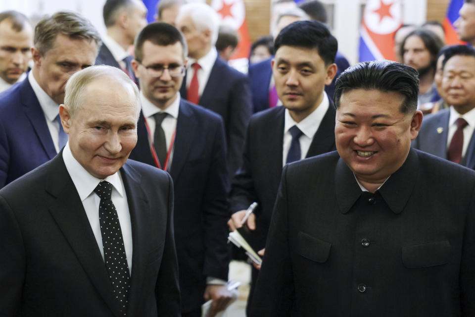 Russian President Vladimir Putin, left, and North Korea's leader Kim Jong Un smile as they walk after the talks in Pyongyang, North Korea, on Wednesday, June 19, 2024. (Gavriil Grigorov, Sputnik, Kremlin Photo via AP)