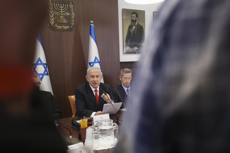 Israeli Prime Minister Benjamin Netanyahu, center, chairs the weekly cabinet meeting at the Prime Minister's office in Jerusalem, Sunday March 5, 2023. (Gil Cohen-Magen/Pool via AP)