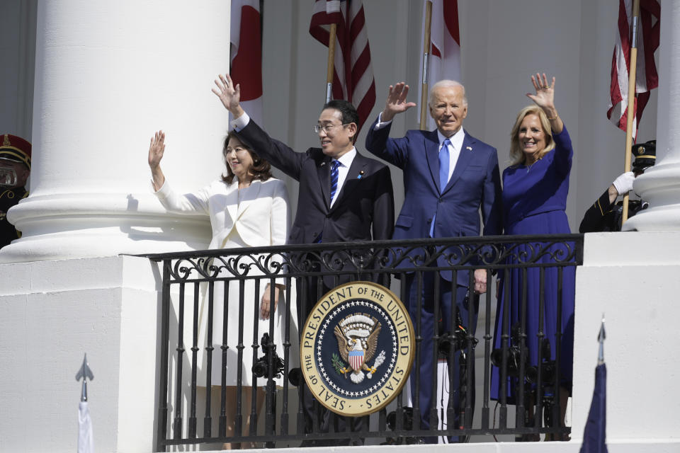 President Joe Biden and first lady Jill Biden, with Japanese Prime Minister Fumio Kishida and his wife Yuko Kishida, wave from the Blue Room Balcony during a State Arrival Ceremony at the White House, Wednesday, April 10, 2024, in Washington. (AP Photo/Alex Brandon)