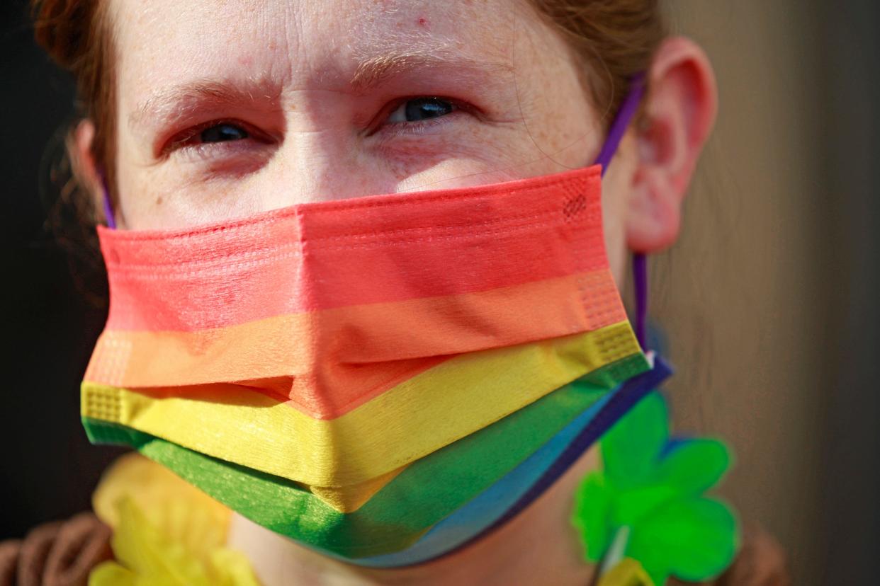 Courtney Walker is shown with her pride-themed mask last year at the Duval County Public Schools building. Hundreds came out to support, protest and speak during the School Board meeting about their support and disappointment with the state's Parental Rights in Education Bill that Gov. Ron DeSantis signed into law and an overhaul of the district's current LGBTQ+ Support Guide.