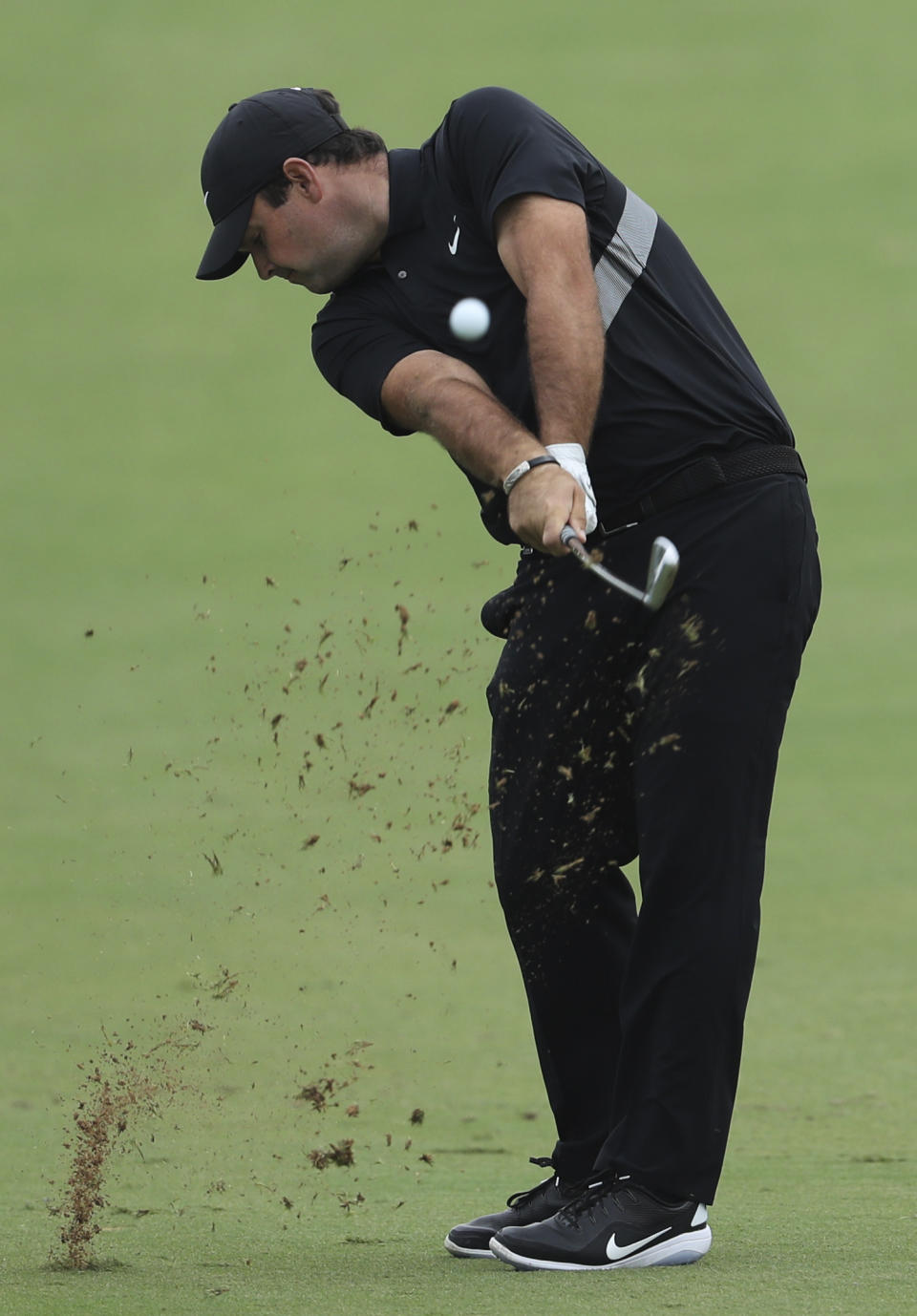 Patrick Reed of the U.S. plays a shot on the first hole during the first round of the DP World Tour Championship golf tournament in Dubai, United Arab Emirates, Thursday, Nov. 21, 2019. (AP Photo/Kamran Jebreili)