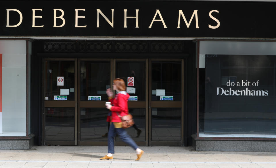 A person walks past a Debenhams department store in Southsea, Hampshire, which has been named as one of 22 stores to be closed, putting 1,200 jobs at risk across the department store chain.