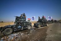 Members of Iraqi federal forces gather to continue to advance in military vehicles in Kirkuk, Iraq October 16, 2017. REUTERS/Stringer NO RESALES. NO ARCHIVES