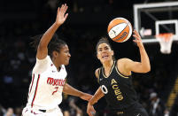 Washington Mystics guard Ariel Atkins (7) guards against Las Vegas Aces guard Kelsey Plum (10) during the first half of a WNBA basketball game Saturday, June 25, 2022, in Las Vegas. (Steve Marcus/Las Vegas Sun via AP)