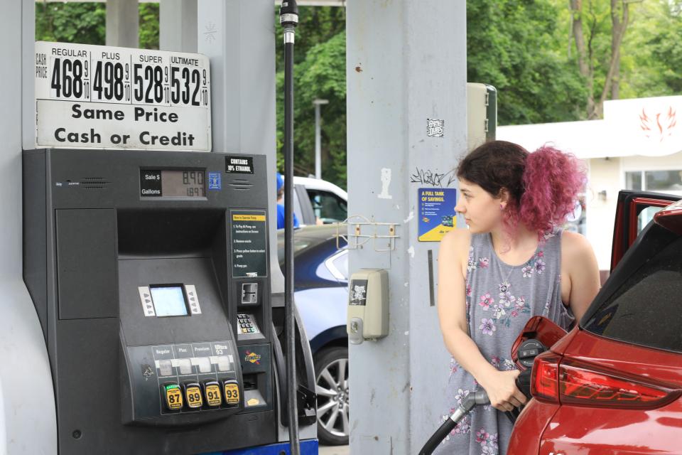 Sophia Spradlan of Wappingers Falls pumps gas while at the Sunoco gas station in the Village of Wappingers Falls on June 1, 2022. 