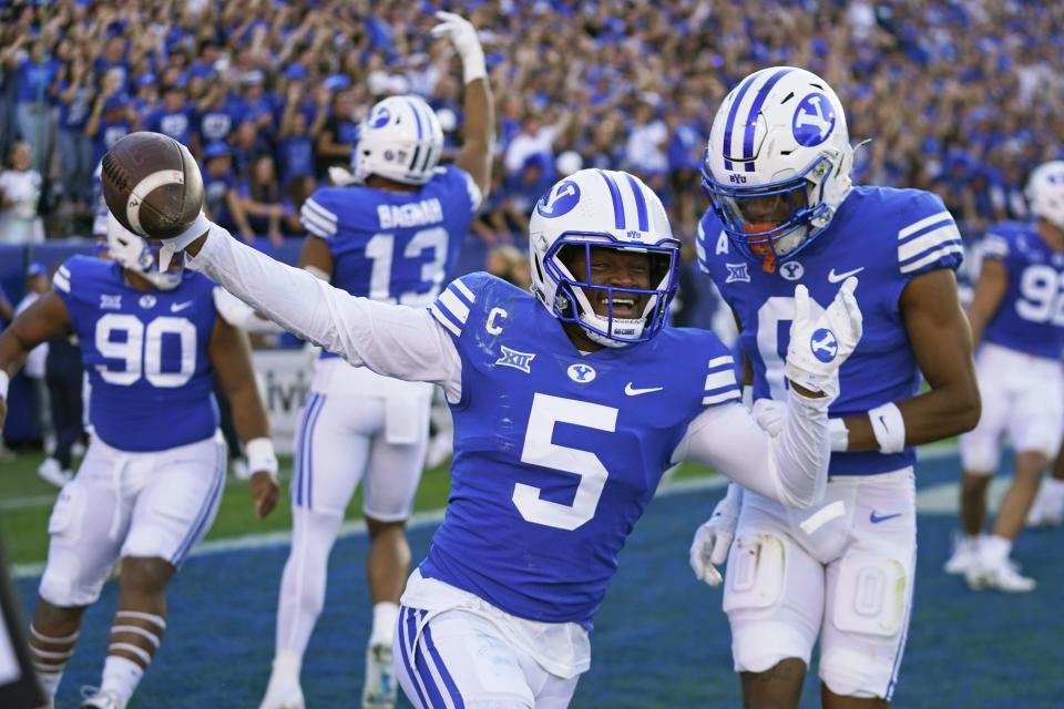 BYU cornerback Eddie Heckard (5) celebrates his fumble recovery touchdown during a game against Texas Tech on Saturday, Oct. 21, 2023, in Provo, Utah. | Rick Bowmer, Associated Press