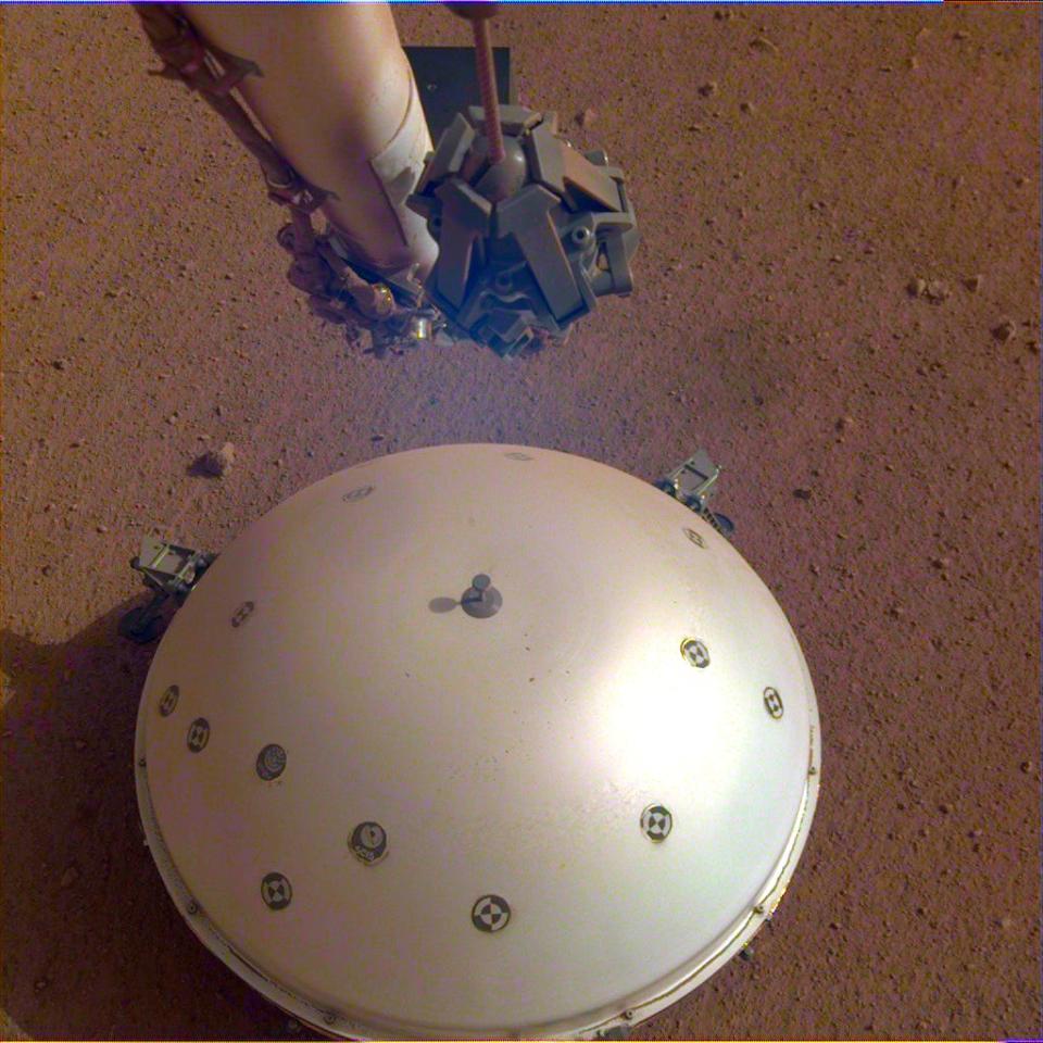 insight seismometer white dome on mars surface dirt