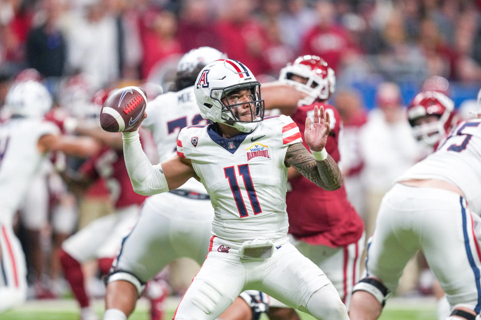 Dec 28, 2023; San Antonio, TX, USA; Arizona Wildcats quarterback Noah Fifita (11) throws a pass in the first half against the Oklahoma Sooners at Alamodome. Mandatory Credit: Daniel Dunn-USA TODAY Sports