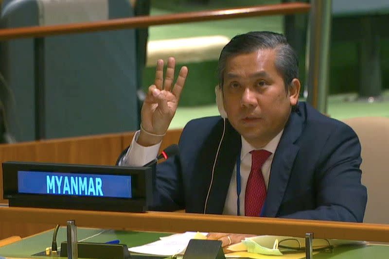 Myanmar's ambassador to the United Nations Kyaw Moe Tun holds up three fingers at the end of his speech in New York