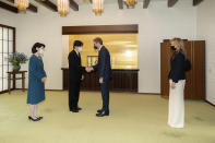 In this photo provided by the Imperial Household Agency of Japan, Greek Prime Minister Kyriakos Mitsotakis, center right, with his wife Mareva Grabowski, right, are greeted by Japan's Crown Prince Akishino and Crown Princess Kiko during a meeting at the Imperial Palace in Tokyo Monday, Jan. 30, 2023. (Imperial Household Agency of Japan via AP)