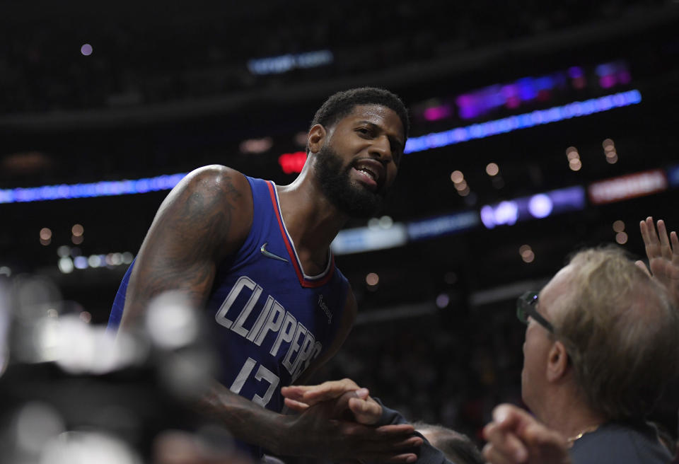 LOS ANGELES, CA - MARCH 29: Paul George #13 of the Los Angeles Clippers celebrates with fans after forcing a turnover against the Utah Jazz during the second half at Crypto.com Arena on March 29, 2022 in Los Angeles, California. NOTE TO USER: User expressly acknowledges and agrees that, by downloading and/or using this Photograph, user is consenting to the terms and conditions of the Getty Images License Agreement. (Photo by Kevork Djansezian/Getty Images)