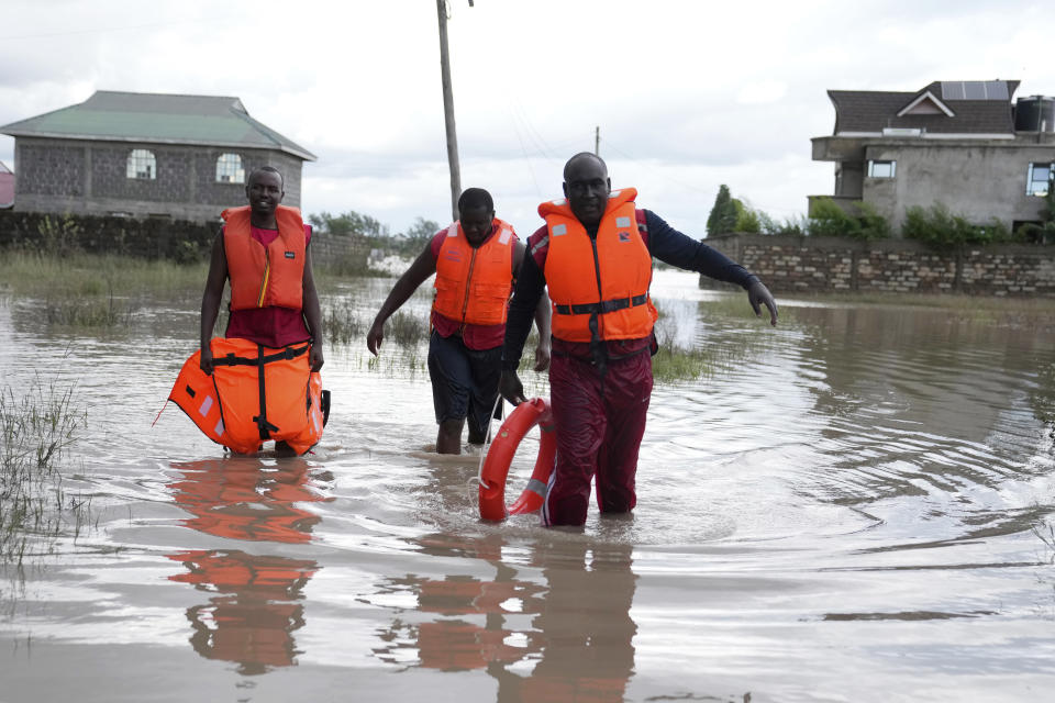 FILE - Kenyan Red Cross personnel and volunteers conduct search and rescue missions, around houses submerged by flood water in Machakos county, Kenya, April 22, 2024. (AP Photo/Brian Inganga, File)