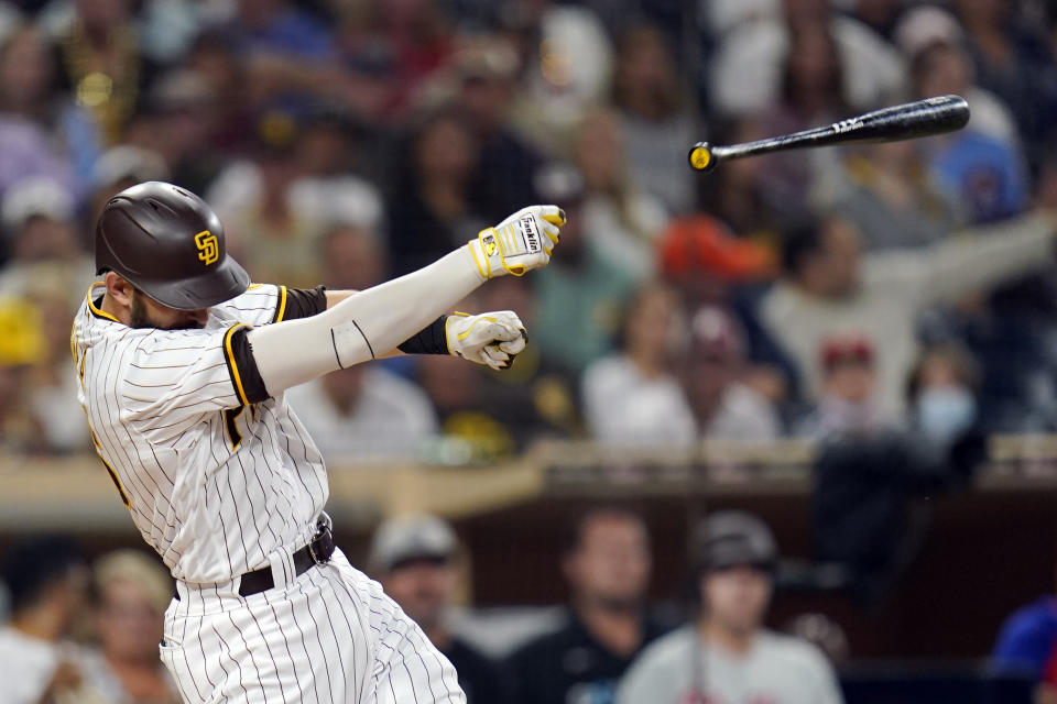 San Diego Padres' Austin Nola loses his bat on a swing during the second inning of the team's baseball game against the Philadelphia Phillies, Friday, Aug. 20, 2021, in San Diego. (AP Photo/Gregory Bull)