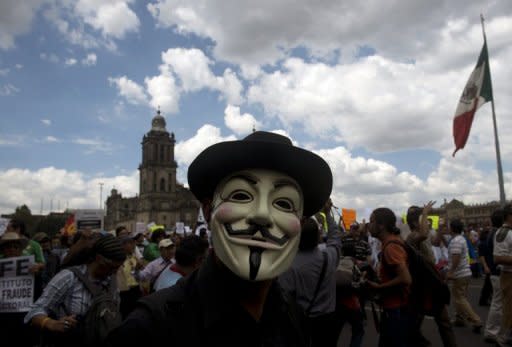 Tens of thousands of demonstrators marched through Mexico City Saturday against the presidential election win of Enrique Pena Nieto, accusing him and his party of widespread vote-buying