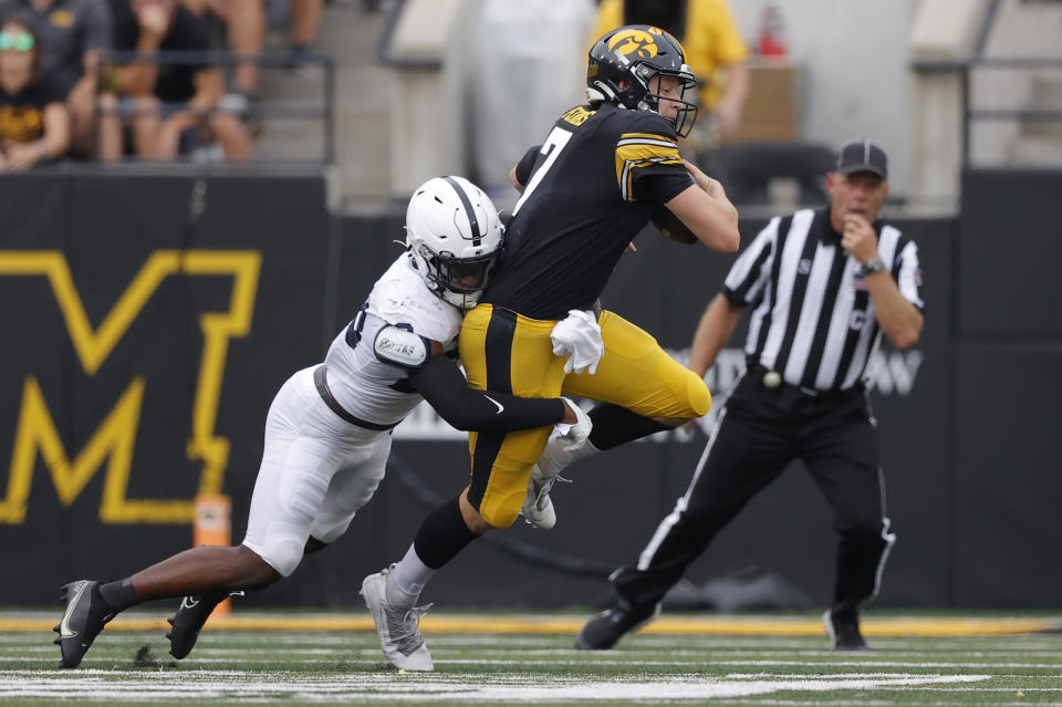 Penn State linebacker Curtis Jacobs (23) sacks Iowa quarterback Spencer Petras (7) during the first half of an NCAA college football game, Saturday, Oct. 9, 2021, in Iowa City, Iowa. (AP Photo/Matthew Putney)