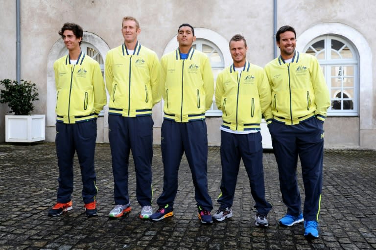 Australia's (from L) Thanasi Kokkinakis, Chris Guccione, Nick Kyrgios, Lleyton Hewitt and their captain Patrick Rafter pose before the draw for their Davis Cup first-round tie against France, in La Roche-sur-Yon, western France, in January 2014