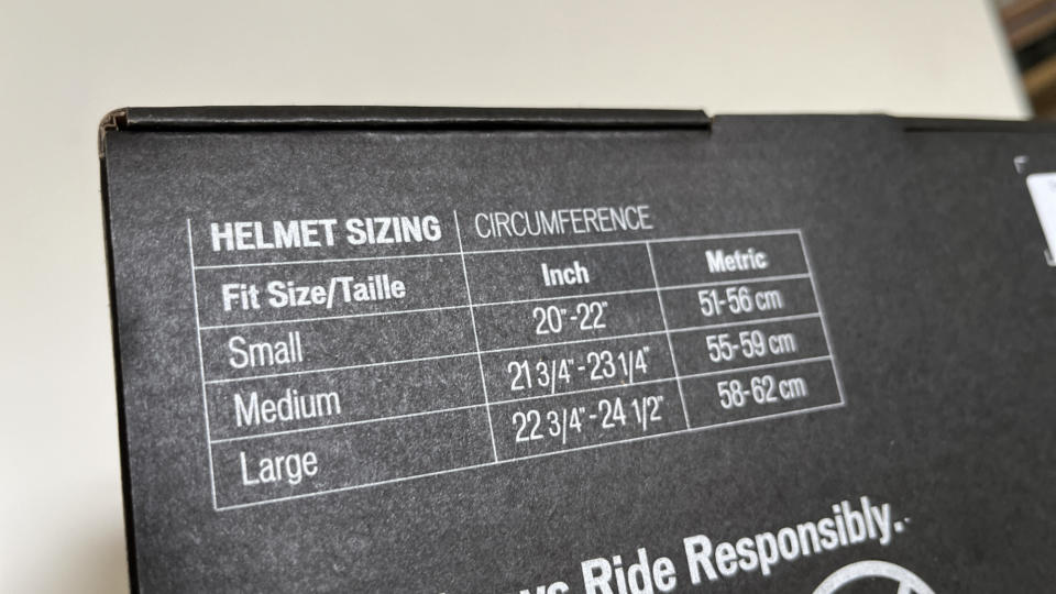 A helmet sizing guide found on the back of a Specialized helmet box