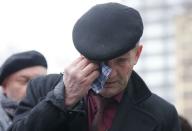 A man reacts as he waits to attend a memorial service before the funeral of Russian leading opposition figure Boris Nemtsov in Moscow, March 3, 2015.REUTERS/Maxim Shemetov