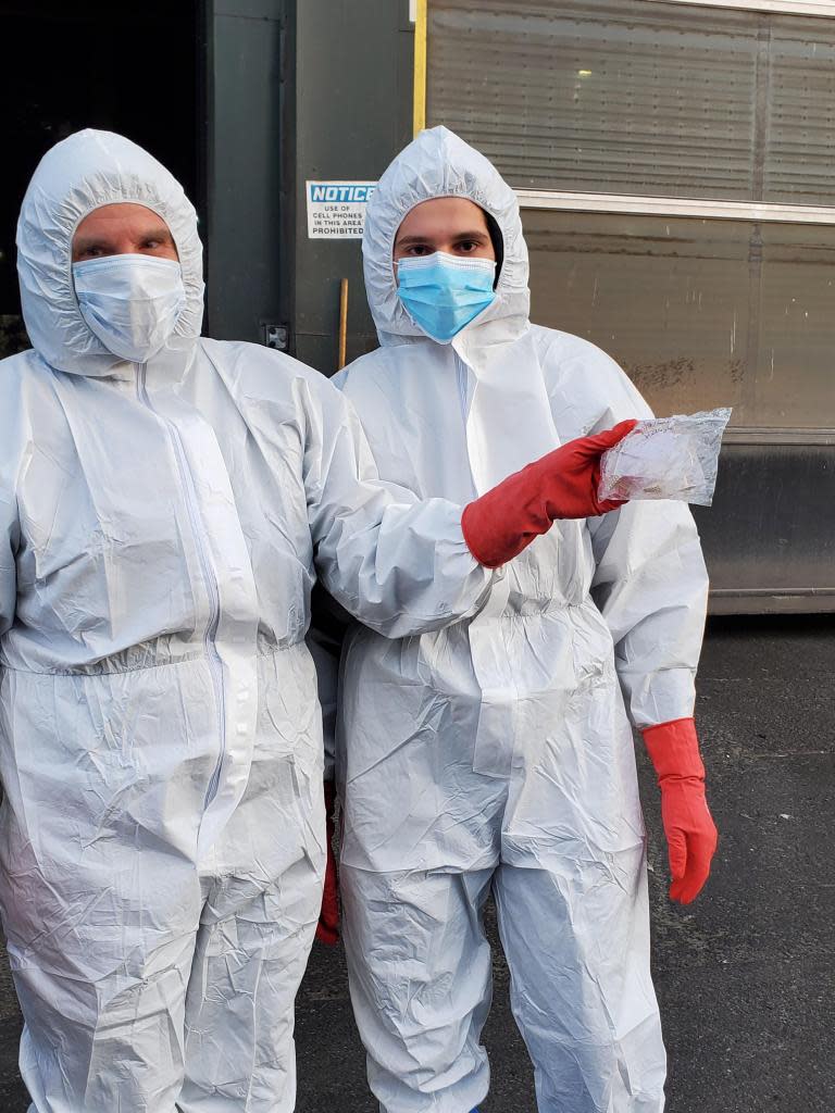 The sanitation department advises wearing gloves, masks and boots for a trash dig. The people went all out with head-to-toe coverage and successfully reclaimed a sandwich bag full of jewelry. DSNY