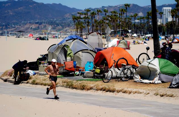 A homeless encampment forms on Venice Beach in Los Angeles on June 8, 2021. 