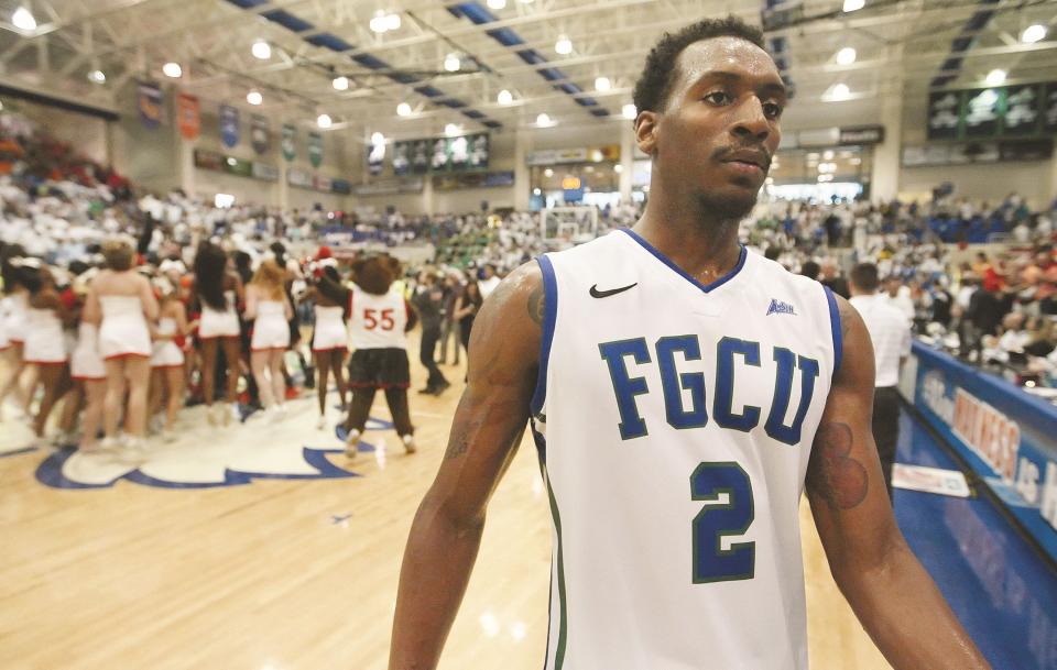 FGCU's Bernard Thompson leaves the court after losing to Mercer in the ASUN Tournament championship game at Alico Arena on March 9, 2014.