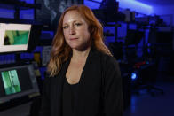 Erin Burke, Section Chief of the Child Exploitation Investigations Unit at Homeland Security, poses for a portrait inside the Victim Identification Lab, part of Homeland Security's Child Exploitation Investigations Unit, in Fairfax, Va., Friday, Nov. 22, 2019. The Homeland Security Investigations section's little-known Child Exploitation Investigations lab is where agents scour disturbing photos and videos of child sexual abuse. They look for unlikely clues that help them identify the children and bring their abusers to justice. In one case, it was the loud, persistent chirping of a bird. Another time, it was unusual playground equipment. (AP Photo/Jacquelyn Martin)