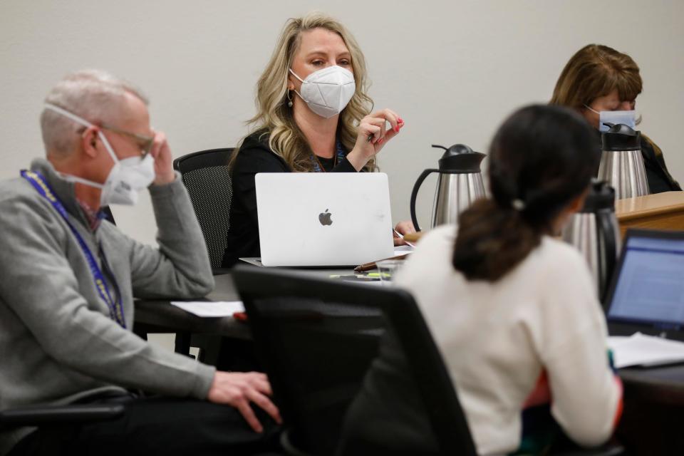 Springfield Public School Board president Alina Lehnert, center, speaks during a meeting to decide on whether to reinstate a temporary mask mandate on Friday, Jan. 28, 2022.