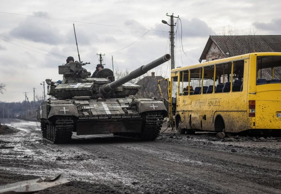 Ukrainian servicemen ride a tank in Torske (Reuters)