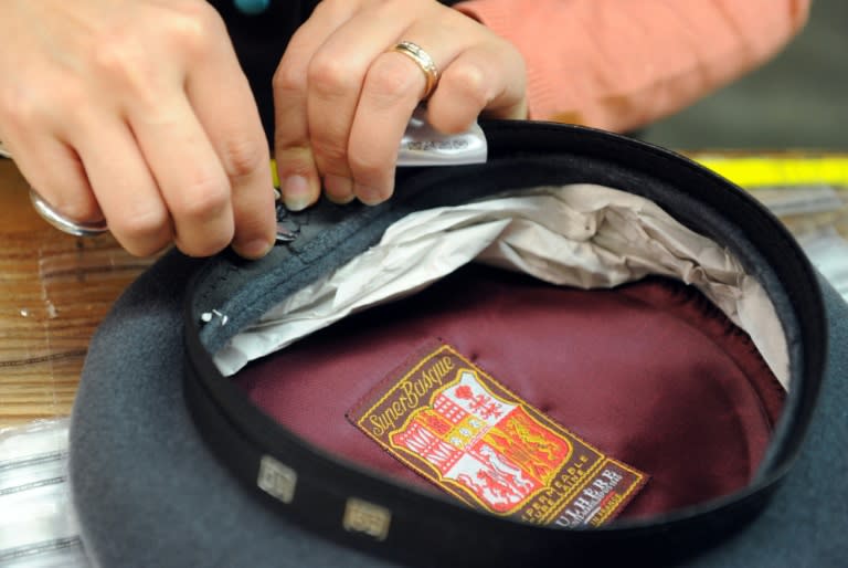 An employee works on a beret at Laulhere factory in Oloron Sainte-Marie, in the French Basque region, southwestern France, on May 19, 2016