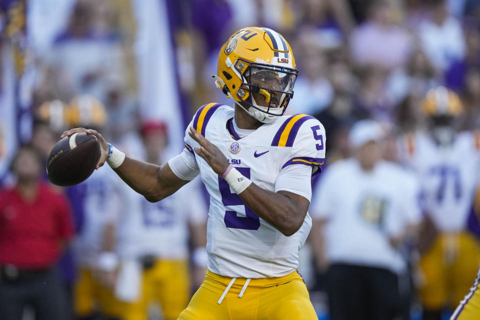 LSU quarterback Jayden Daniels (5) drops back to pass in the first half of an NCAA college football game against Auburn in Baton Rouge, La., Saturday, Oct. 14, 2023. (AP Photo/Gerald Herbert)