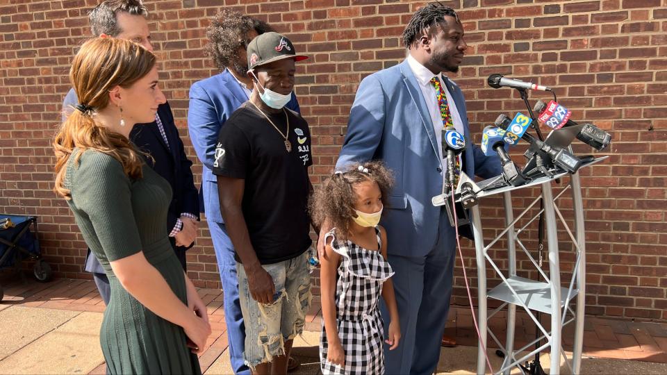 Attorney Malcom Ruff is joined at the podium by Kennedi Burns, of Baltimore, during a press conference announcing a federal discrimination lawsuit against Sesame Place on July 27, 2022 in Philadelphia.