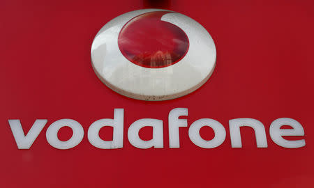 FILE PHOTO: A branded sign is displayed on a Vodafone store in London, Britain May 16, 2017. REUTERS/Neil Hall