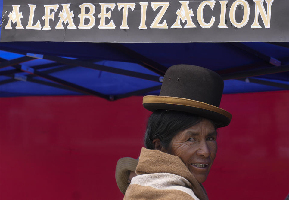 An Aymara woman waits to receive her certificate during an adult literacy graduation ceremony in Pucarani, Bolivia, Sunday, Dec. 4, 2022. (AP Photo/Juan Karita)