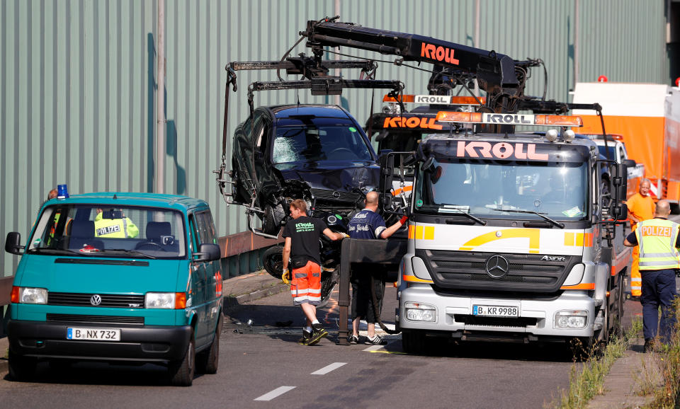 Police officers stand at the scene of a series of allegedly deliberate car crashes on highway A100 in Berlin, Germany, August 19, 2020. REUTERS/Fabrizio Bensch