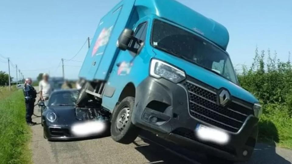 Van backs into Porsche 911 in France, claims he wasn't visible in mirrors