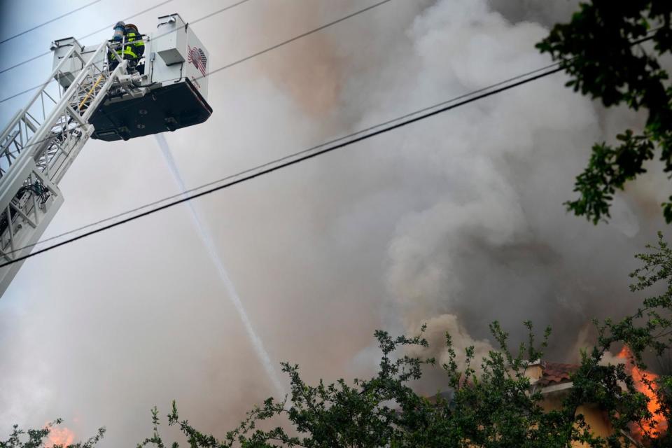 PHOTO: City of Miami Fire Rescue firefighters work at the scene of a fire at the Temple Court apartments Monday, June 10, 2024, in Miami. (Lynne Sladky/AP)