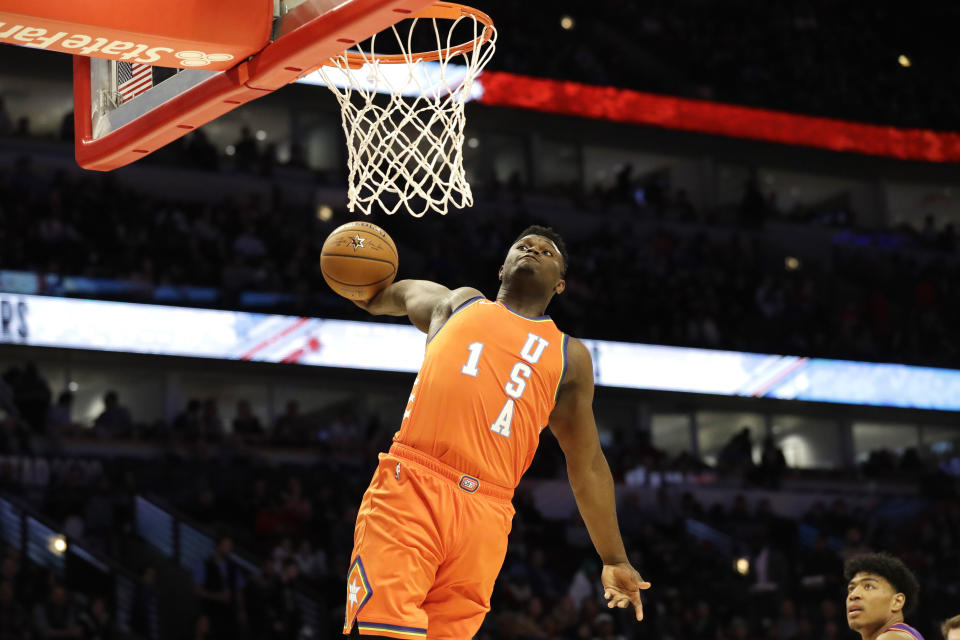 Team USA forward Zion Williamson, of the New Orleans Pelicans, goes up for a dunk against Team World during the second half of the NBA Rising Stars basketball game in Chicago, Friday, Feb. 14, 2020. (AP Photo/Nam Y. Huh)