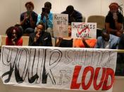 Members of the black community attend a open forum to speak to the city council in Charlotte, North Carolina, U.S., September 26, 2016. REUTERS/Mike Blake