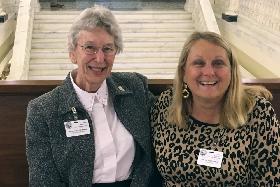 In this photo provided by the Presentation Sisters, Sister Kathleen Bierne, left, poses for a photo with Deb Fischer-Clemens, a longtime healthcare lobbyist and a former lawmaker, at the state capitol in Pierre, South Dakota, in March 2017. Fischer-Clemens mentored Bierne when the Catholic sister became a state lobbyist for the Presentation Sisters. (Presentation Sisters via AP)