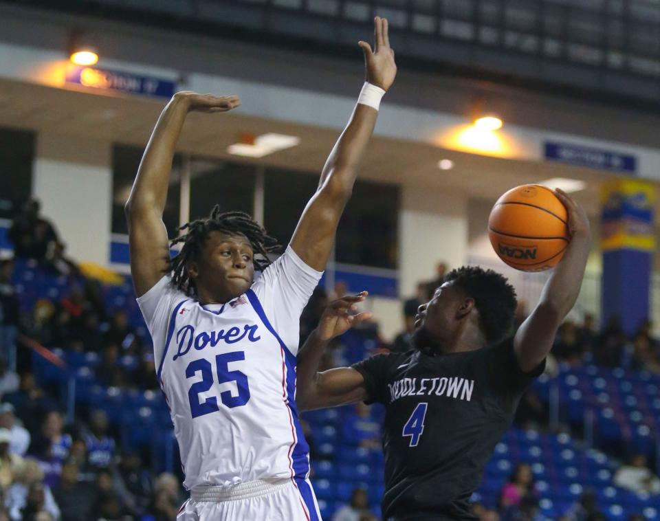 Dover's Istavan Norwood (left) defends a drive by Middletown's Zion Mifflin in the first half of a DIAA state tournament semifinal at the Bob Carpenter Center, Thursday, March 7, 2024.