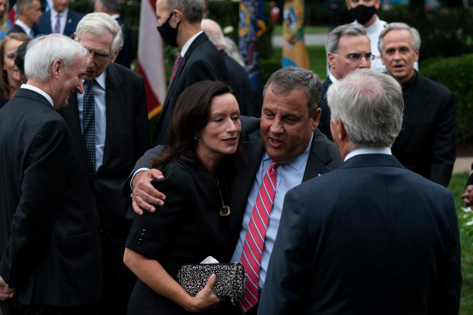 Former New Jersey Gov. Chris Christie, front second from right, speaks with others after President Donald Trump announces Judge Amy Coney Barrett as his nominee to the Supreme Court in the Rose Garden of the White House on Sept. 26. Notre Dame President Father John Jenkins stands at back right.